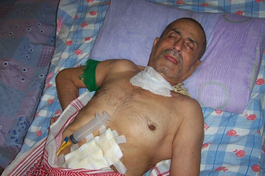 Sadiq Zoman at home in what doctors describe call a 'persistent vegetative state.' (Dahr Jamail/TNS)